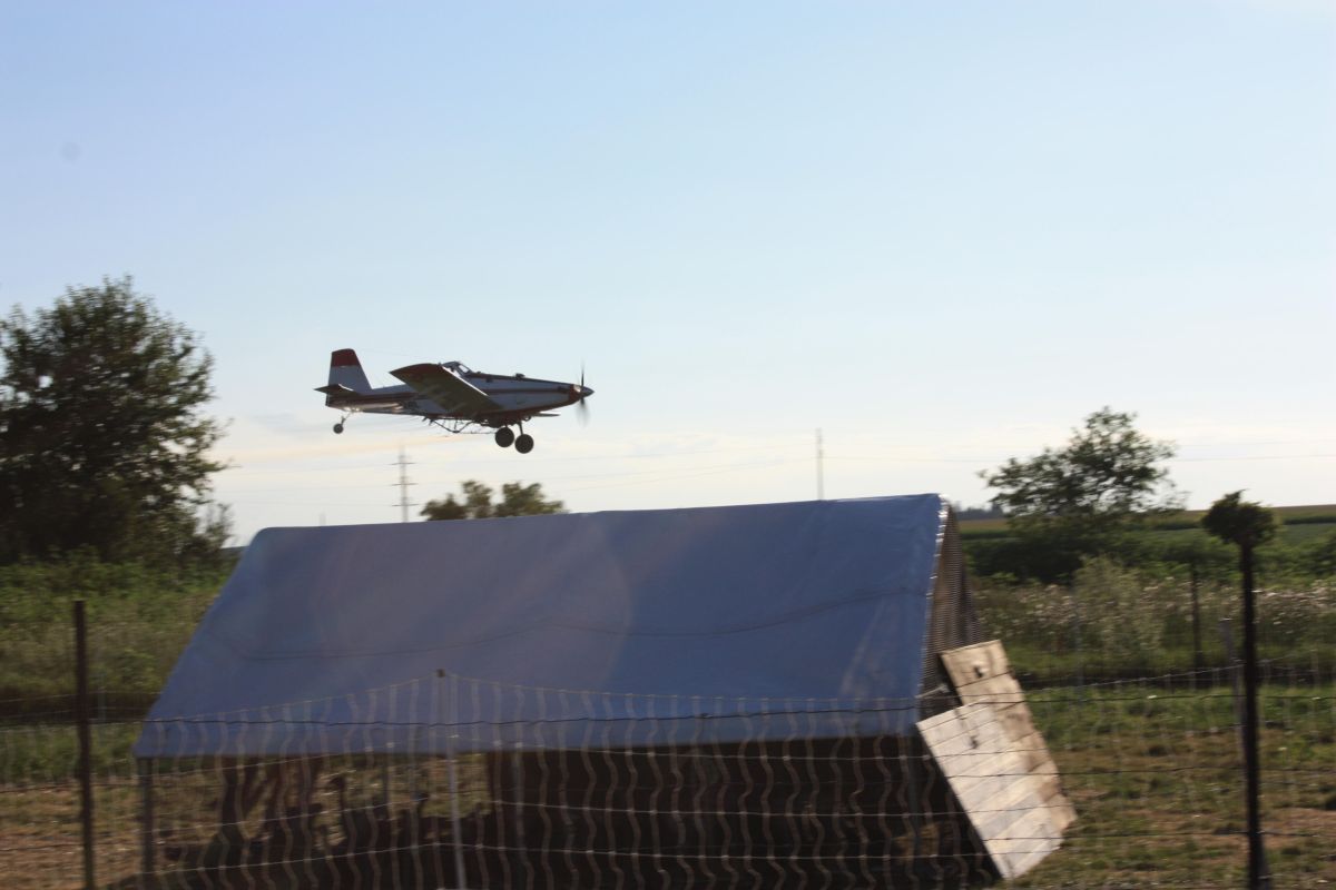spray plane over small-scale diversified farm