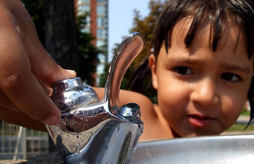 Child at water fountain