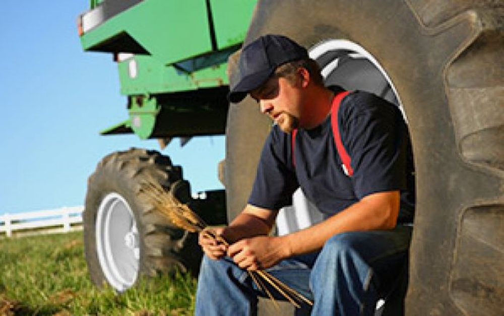 farmbill-farmer-tractor-wheel-groundtruth-blog-image