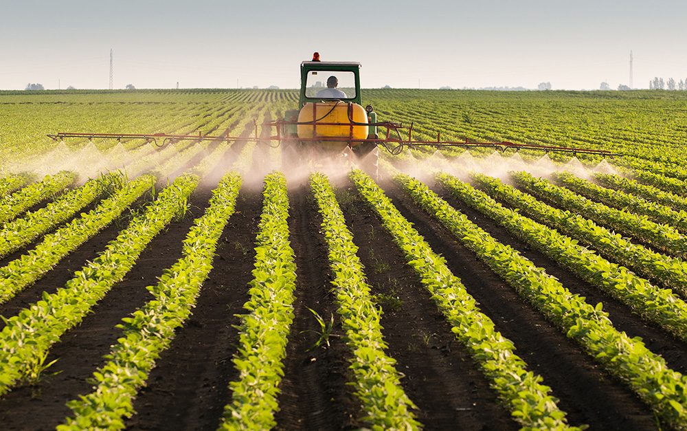 Tractor spray pesticides